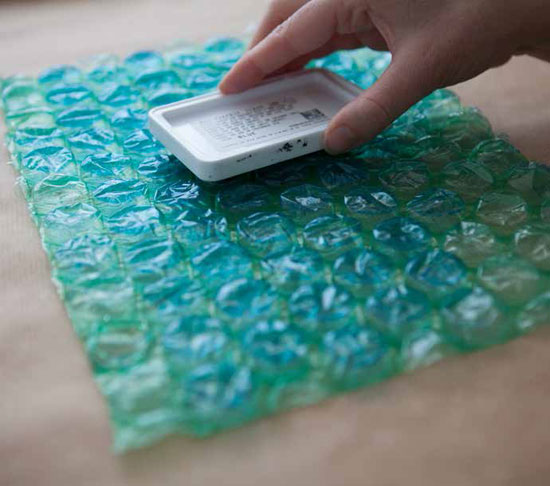 Tap the ink pad over the surface of the bubble wrap until well inked.